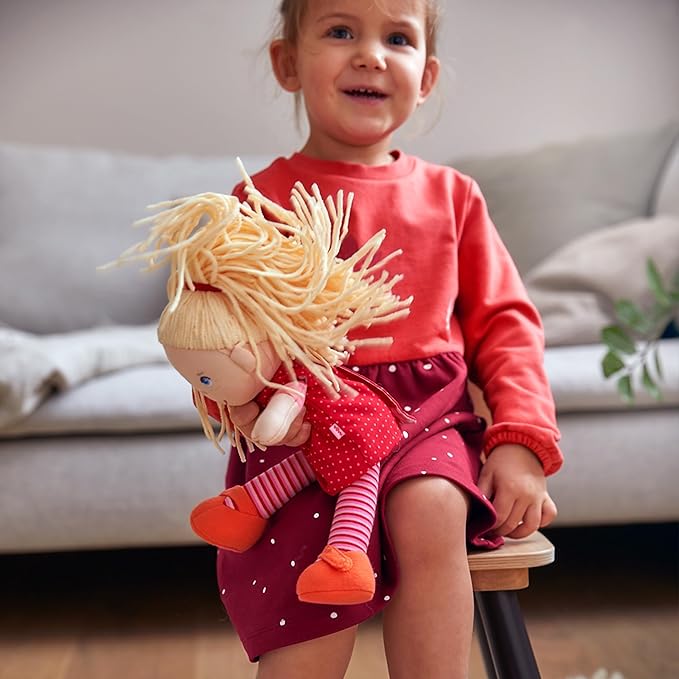 HABA 12" Soft Baby Doll Annelie with Blonde Hair, Embroidered Face, Removable Red Dress and Matching Hairband - Washable Toddler Doll for 18 Months+