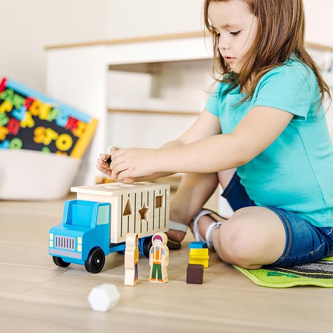 Melissa & Doug Shape-Sorting Wooden Dump Truck Toy, Quality Craftsmanship, 9 Colorful Shapes and 2 Play Figures, 7.5' H X 10.75' W X 4.75' L